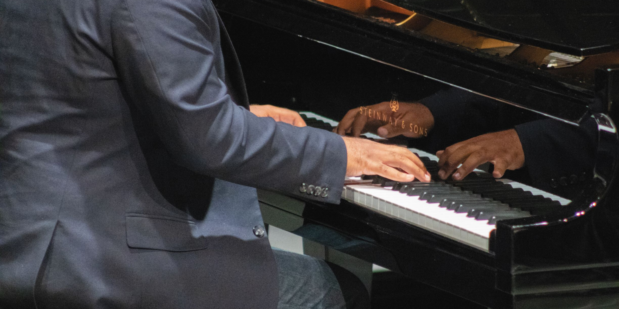 male black hands playing on piano kets